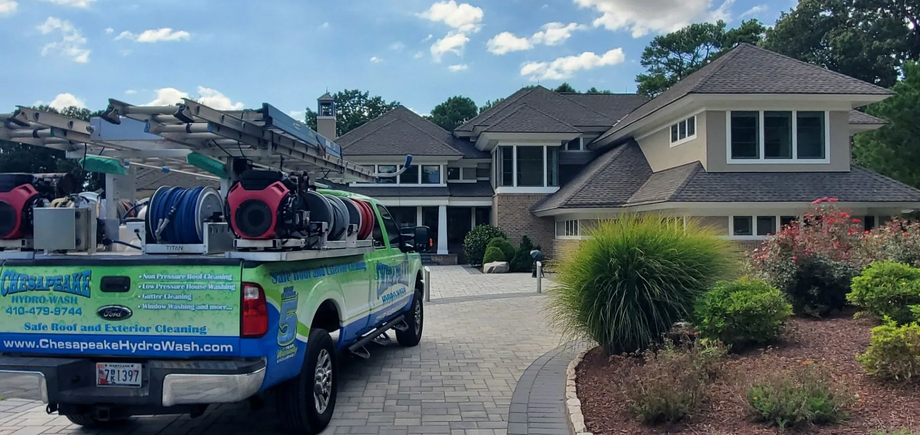 Chesapeake Hydro-Wash truck and equipment ready beside a Maryland property